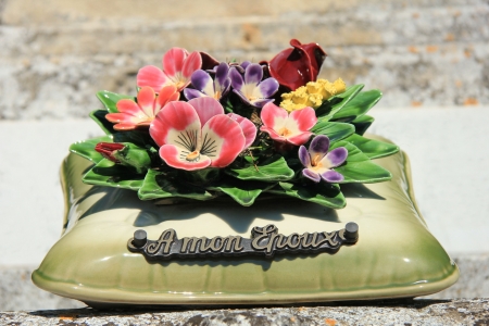 Grave ornament in France: pillow with flowers "to my husband"の写真素材