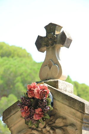 Funeral wreath with ceramic flowers at a French cemeteryの写真素材