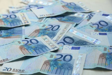 Twenty euro notes, spead over a table