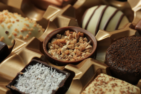 Luxurious Chocolates in various shapes and flavors in a gift boxの写真素材
