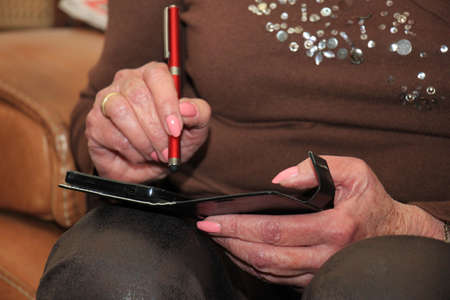 A senior woman busy with her smartphoneの写真素材