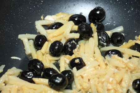 Fusilli with olives, cheese sauce with asparagusの写真素材