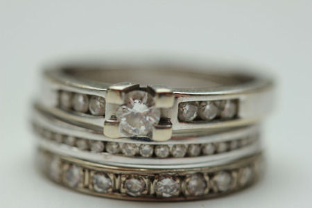 Diamond ring stack: engagement ring, wedding band and anniversary bandの写真素材