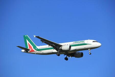 Amsterdam, the Netherlands - July 15th 2016:EI-DSB Alitalia Airbus A320, approaching Polderbaan runway at Schiphol Amsterdam Airport, arriving from Rome, Italyのeditorial素材