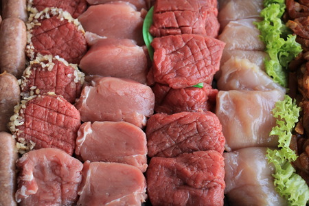 Small pieces of fresh meat for fondue or racletteの写真素材