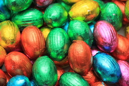 a group of foil wrapped chocolate easter eggs