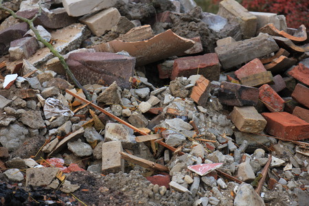 Bricks in a dumpster near a construction site, home renovationの写真素材