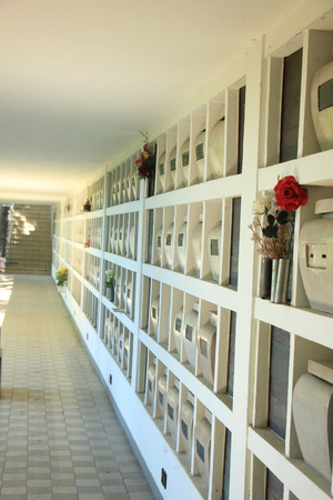 Urns with ashes in a columbarium wallの写真素材