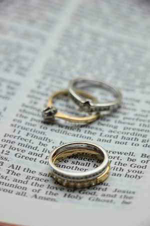 Two diamond wedding bands for a double bride wedding, on a bible verseの写真素材