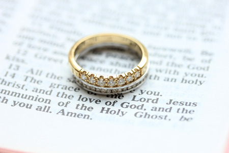 Two diamond wedding bands for a double bride wedding, on a bible verseの写真素材