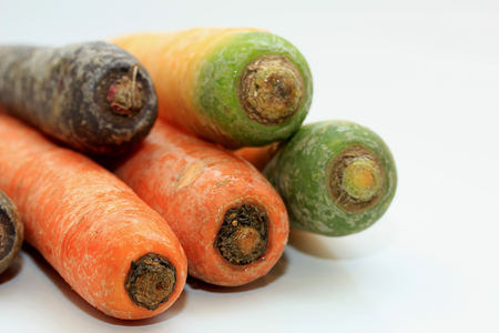 Big fresh carrots in different colors and sizesの写真素材