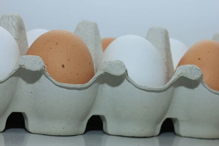 Ten fresh eggs in a carton box