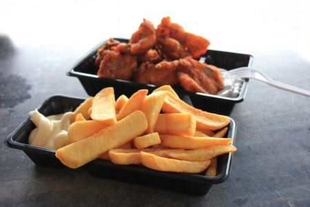 Traditional fried fish and chips, with Mayonnaise and ravigote sauce