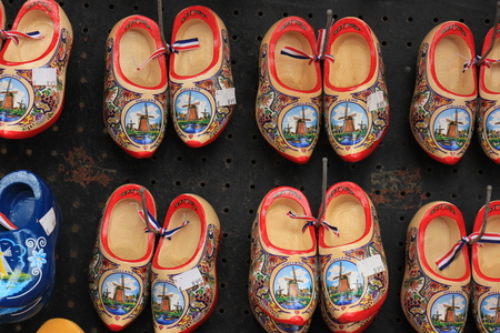 Colorful painted clogs, the traditional Dutch wooden shoes in a tourist shopの写真素材