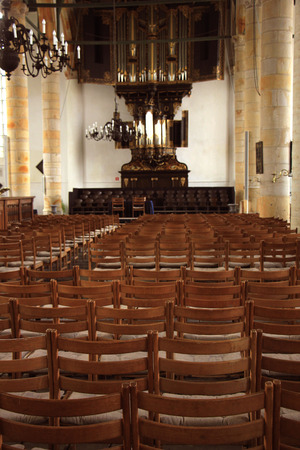 Simple wooden chairs in a Dutch Reformed Churchのeditorial素材