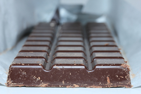 a dark chocolate bar , blocks in closeupの写真素材