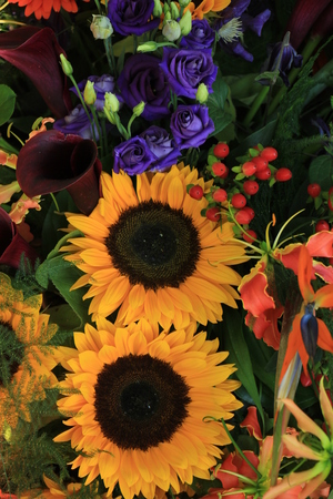 Big yellow sunflowers in a wedding flower arrangementの写真素材