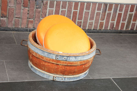 Big Dutch cheese on display in a storeの写真素材