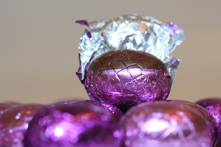 colorful wrapped chocolate easter eggs in close-up, macroの写真素材