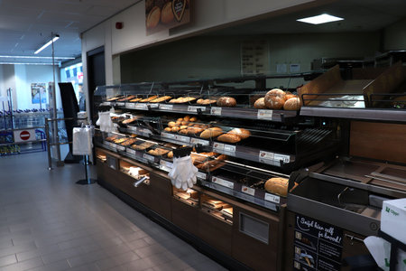 IJmuiden, the Netherlands, July 4th 2018: bakery in supermarket. Text on tags: prices and product...