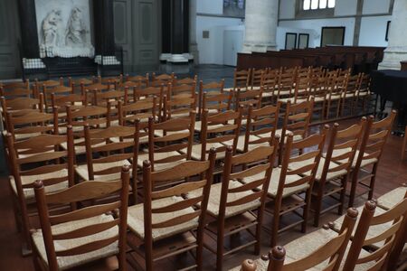 Haarlem, the Netherlands - october 6th, 2018: Wooden chairs in St Bavo church, a Dutch Reformed Churchのeditorial素材