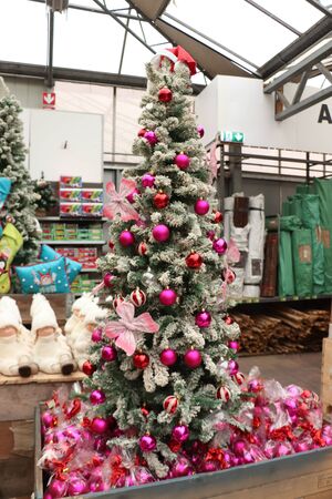 Cruquius, the Netherlands - October 26th 2018: Pink christmas decorations in a tree in an interior decoration shopのeditorial素材