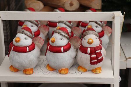 Aalsmeer, the Netherlands - November 7th 2018: Christmas decorations in an interior decoration shop, little birds with hats and shawlのeditorial素材