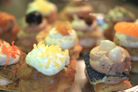 Luxurious decorated snacks with various ingredients, served as finger food at a wedding reception