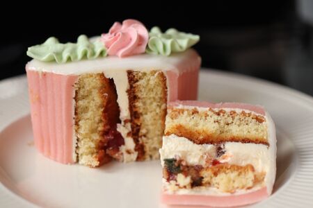 Fresh pink Marzipan confectionery with butter cream decorationsの写真素材