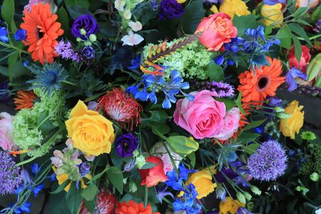 Mixed flower arrangement: various flowers in different colors for a weddingの写真素材