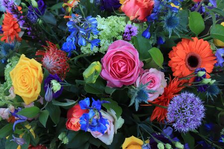 Mixed flower arrangement: various flowers in different colors for a weddingの写真素材