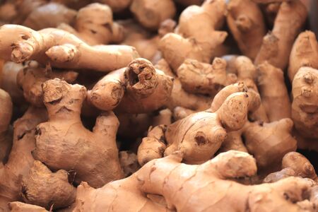 Fresh chunks of ginger at a food marketの写真素材