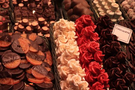 Chocolate roses and slices of orange at a market in Barcelona, Spainの写真素材
