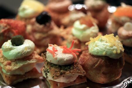 Luxurious decorated snacks with various ingredients, served as finger food at a wedding reception