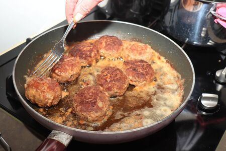 Fresh, oldfashioned made meatballs, fried in a panの写真素材
