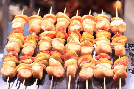 Spanish tapas on a stick, chicken meat and peppersの写真素材