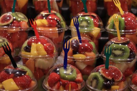 Fresh mixed fruit salads, packed in plastic containers at the marketの写真素材