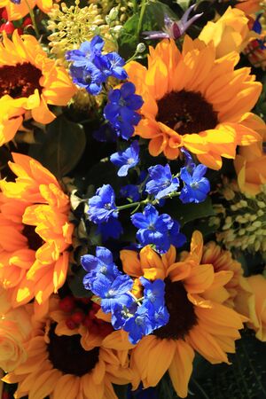 Sunflowers in a yellow and blue wedding arrangementの写真素材