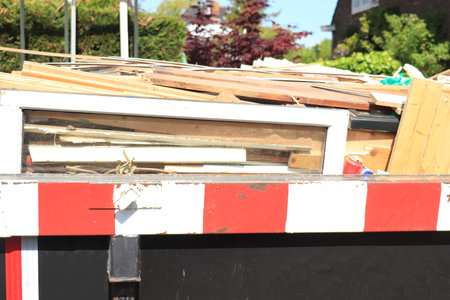 Loaded dumpster near a construction site or home renovation