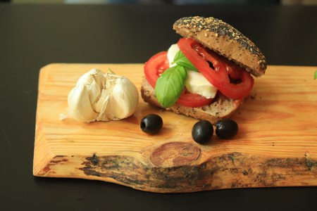 Italian Caprese sandwiches with fresh tomatoes, mozzarella cheese and basil