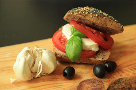 Italian Caprese sandwiches with fresh tomatoes, mozzarella cheese and basilの写真素材