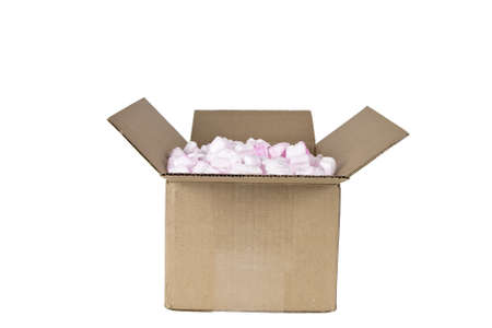Open cardboard box with packing peanuts isolated on whiteの写真素材
