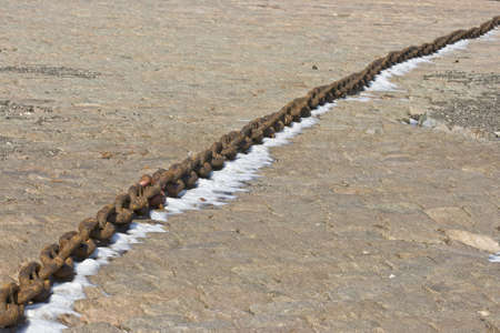 Rusty chain on concreate backgroundの写真素材