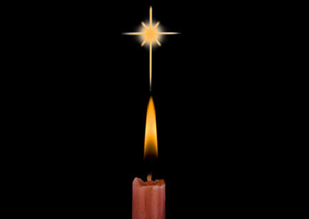Christmas candle burning in the dark の写真素材