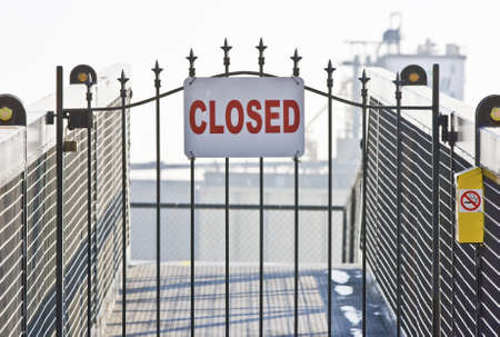 Closed sign on ship yard gateの写真素材