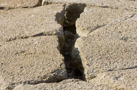 Cracked road concrete close up 