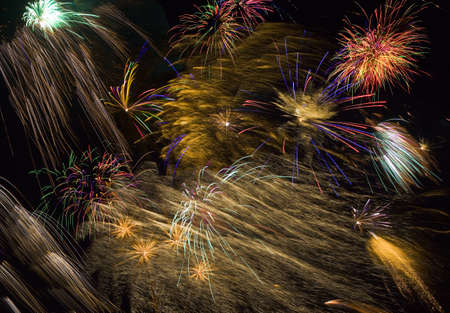 long exposure of multiple fireworks against a black background 