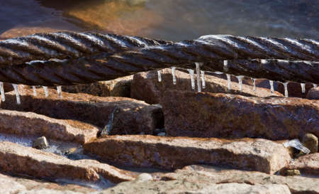 Ice encrusted ship tie linesの写真素材