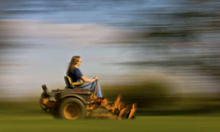 lawn mowing with motion blur showing speedの写真素材
