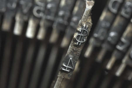 Old typewriter type with focus on dollar symbol 